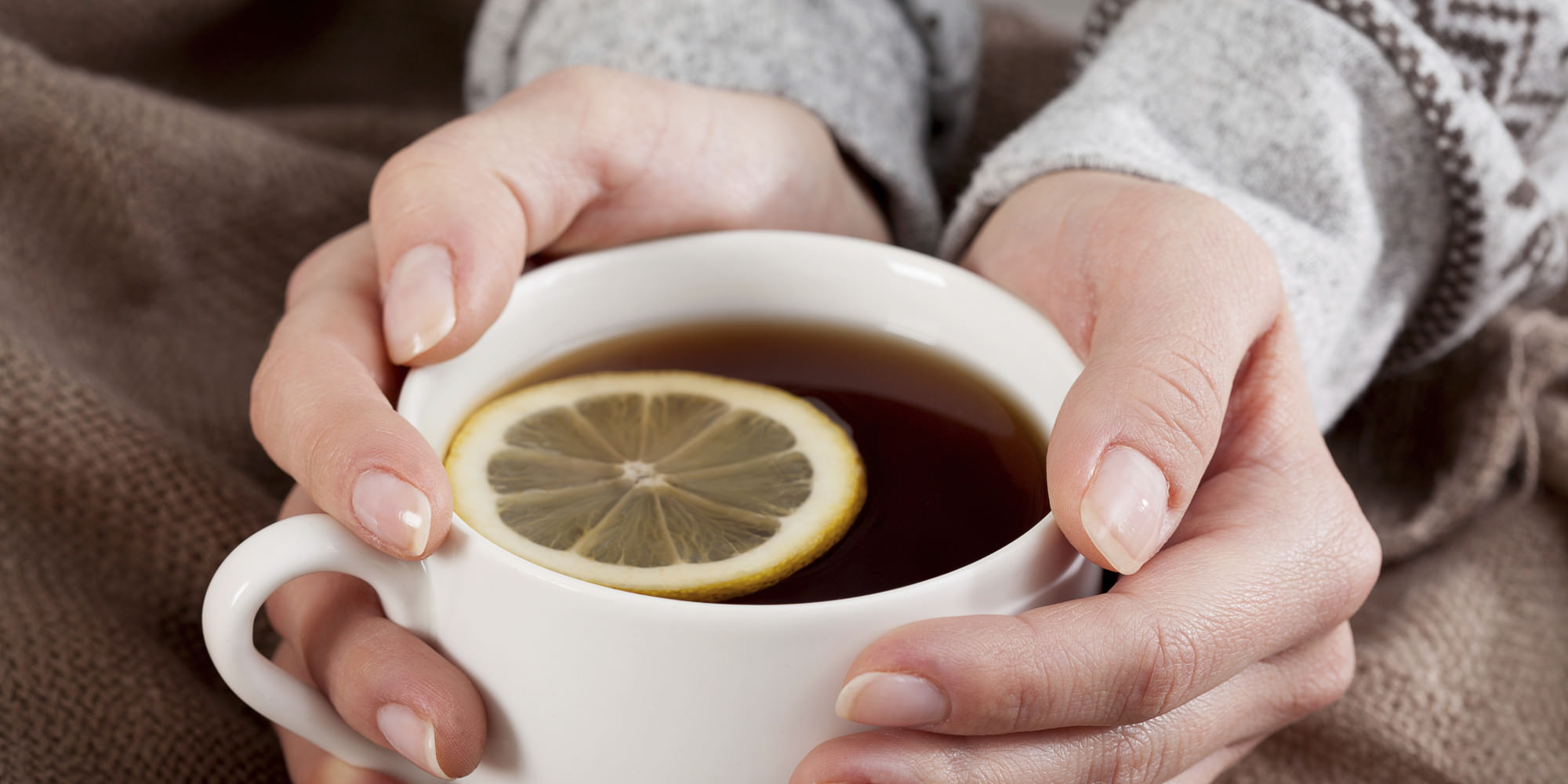 Hands with tea cup