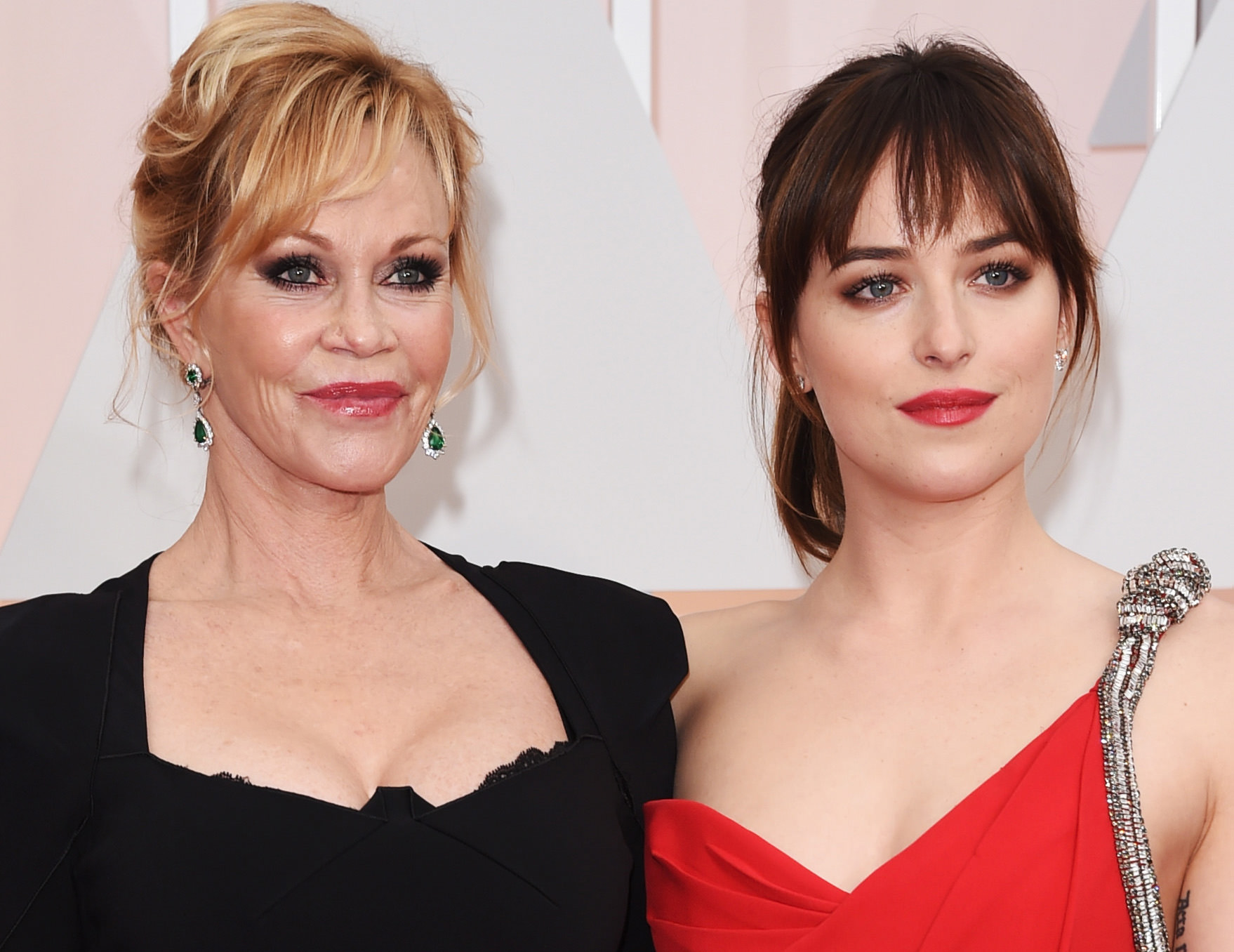 HOLLYWOOD, CA - FEBRUARY 22: Actresses Melanie Griffith (L) and Dakota Johnson attend the 87th Annual Academy Awards at Hollywood & Highland Center on February 22, 2015 in Hollywood, California. (Photo by Jason Merritt/Getty Images)