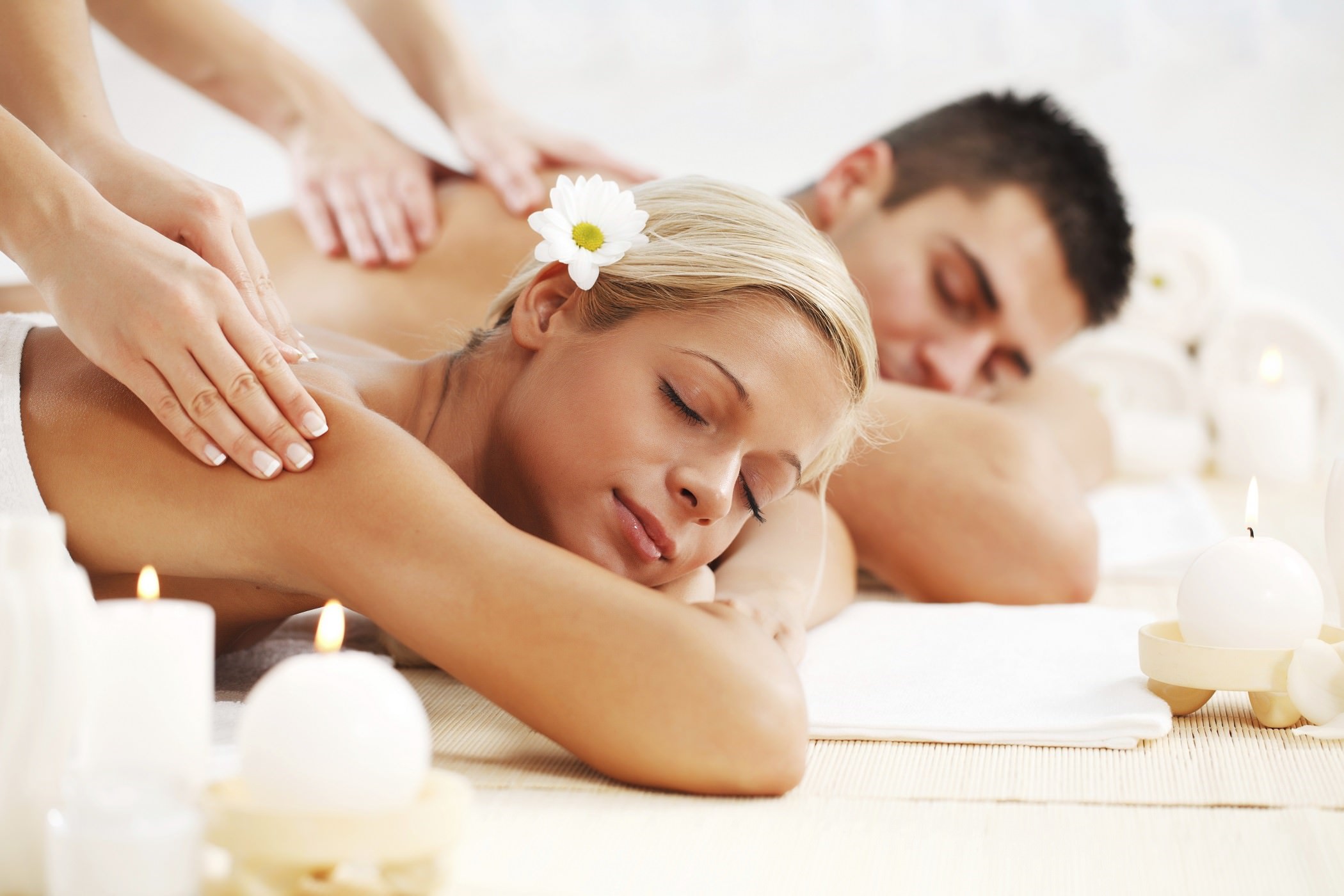 Young couple is having a back massage at the spa centre. [url=http://www.istockphoto.com/search/lightbox/9786786][img]http://dl.dropbox.com/u/40117171/couples.jpg[/img][/url]