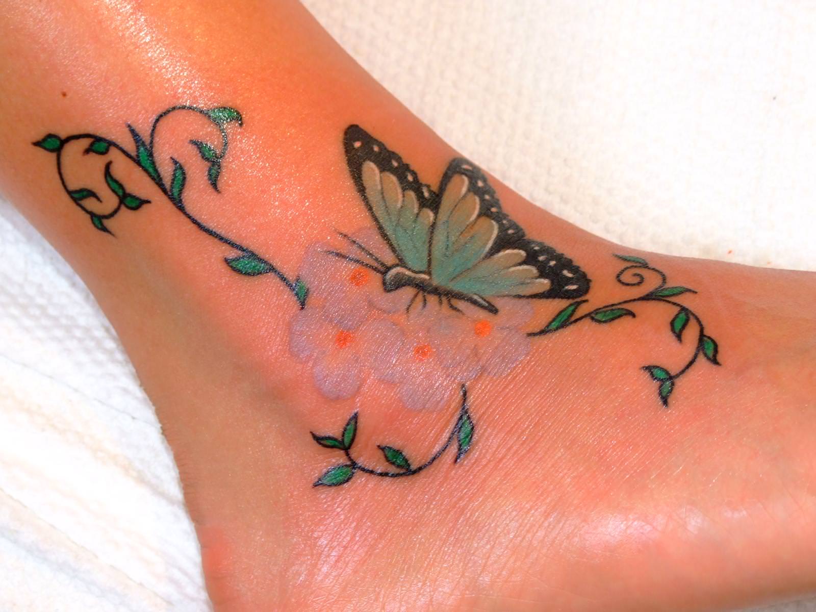 Butterfly-and-flowers-ankle-tattoos