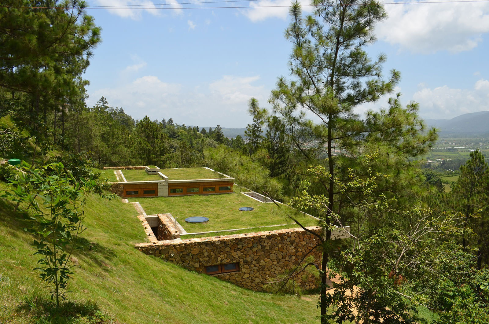 grass-roofed-home-built-slope-hillside-cooling-2-rockwork