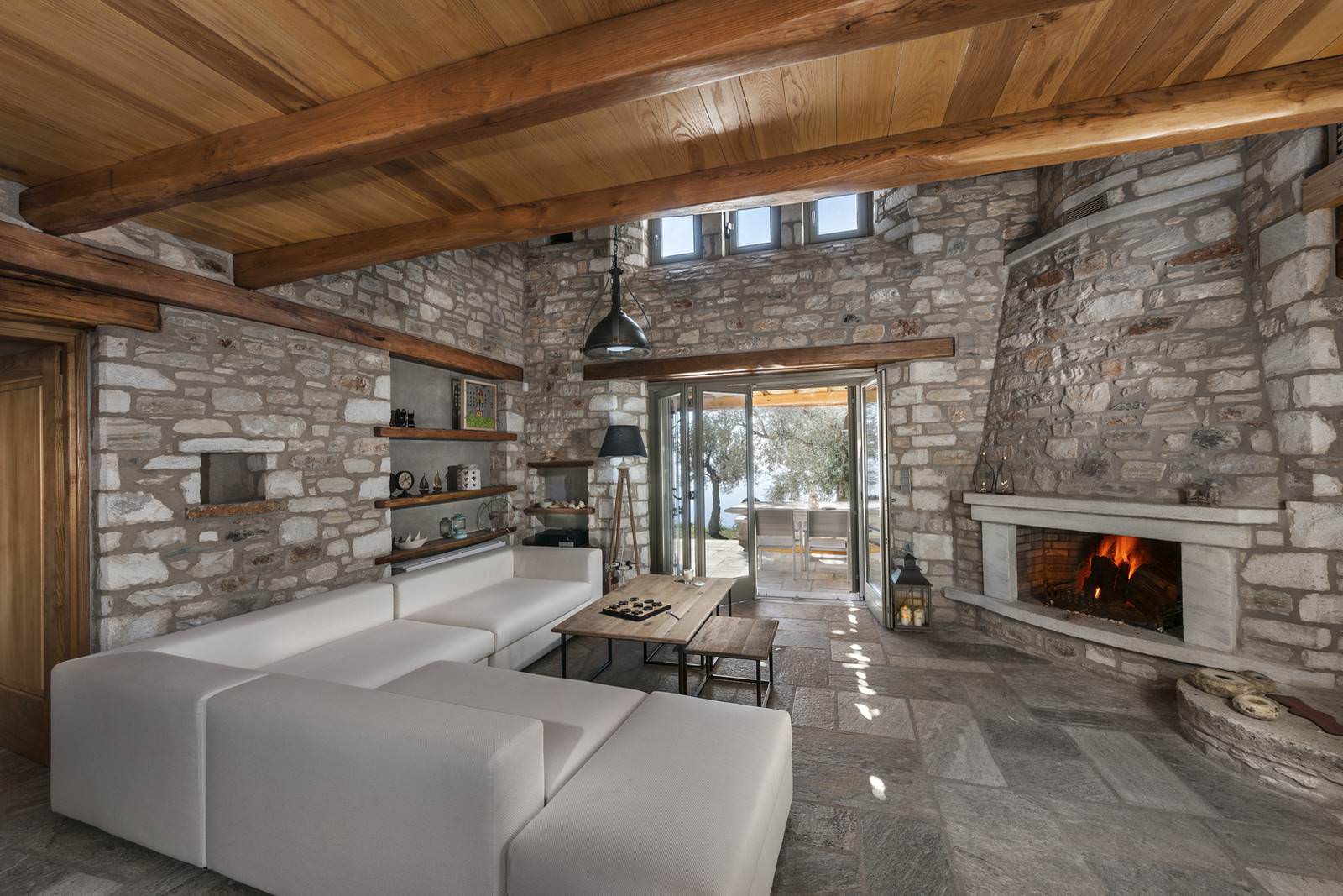 fireplace-τζάκι-stone-house-interior-design-sea-Pelion-living-room-εξοχική-κατοικία-Πήλιο-traditional-local-architecture-εσωτερική-διαμόρφωση-window-3