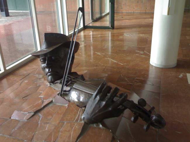 Violinist Bursting from the Floor