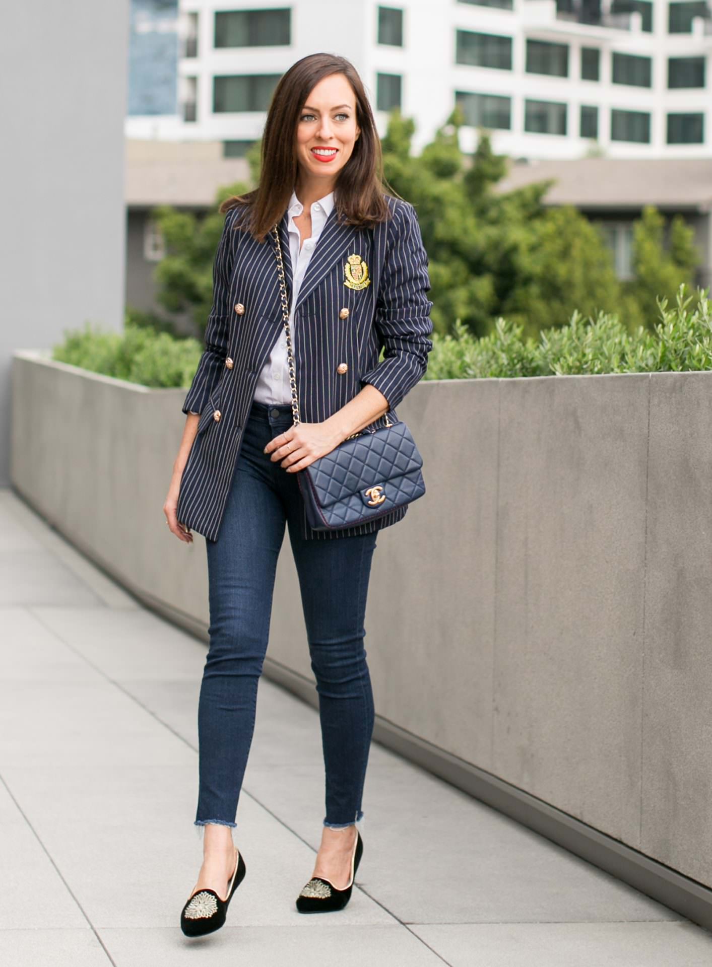 Sydne-Style-shows-casual-office-outfit-ideas-in-a-white-button-down-shirt-and-blazer