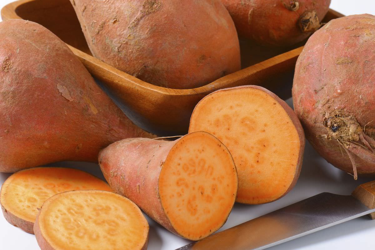 Sweet potatoes with orange flesh (rich source of vitamin A)