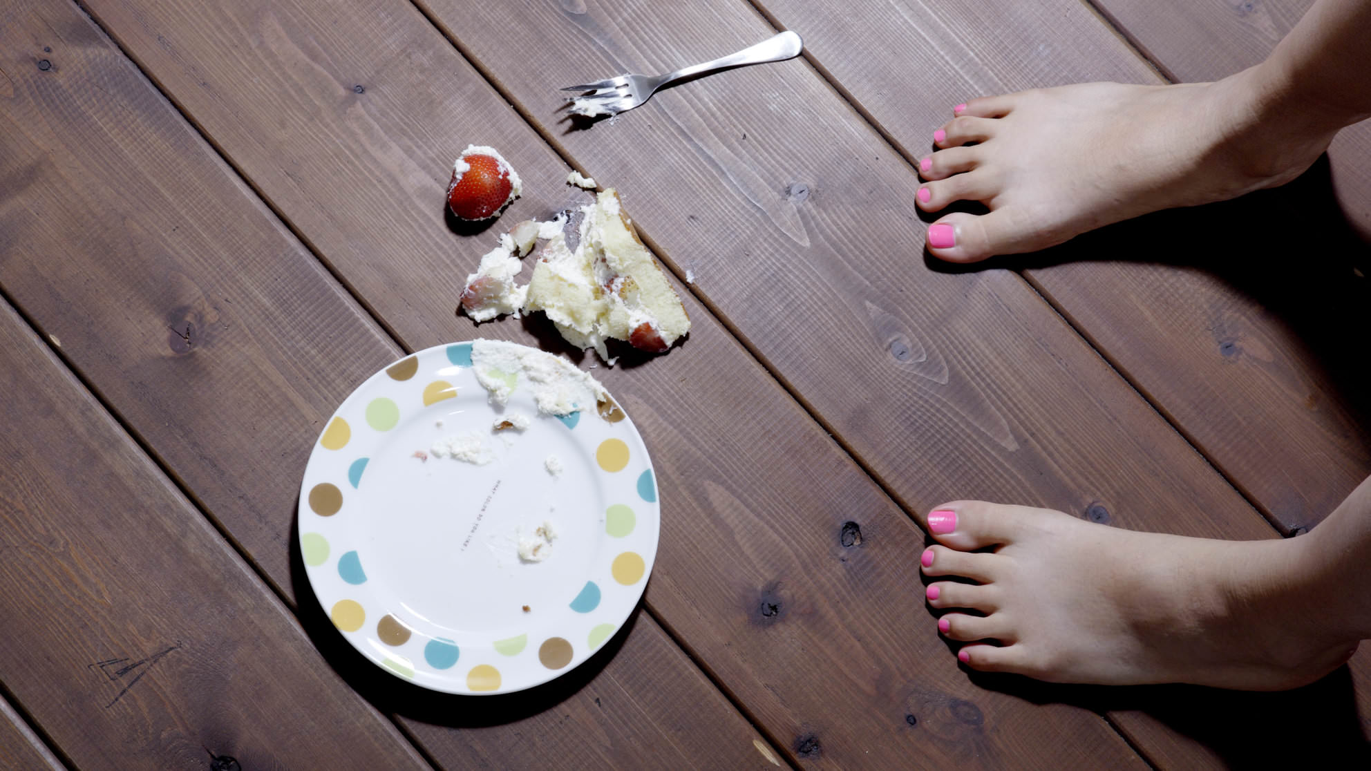 Girl dropping cake on floor