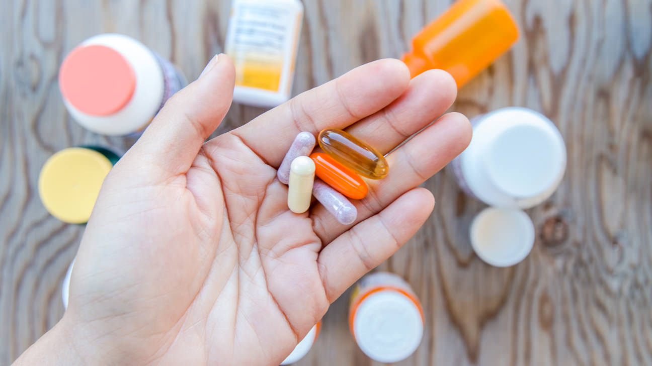 hand_holding_pill-1296x728-header